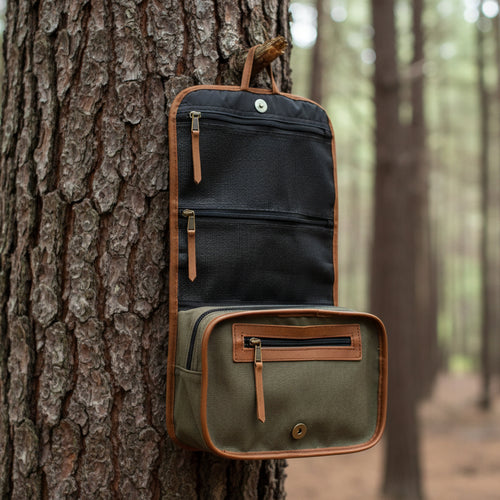 Open hanging toiletry bag on a tree trunk