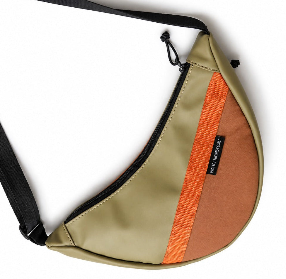 Sling bag made from repurposed vinyl and poly twill
